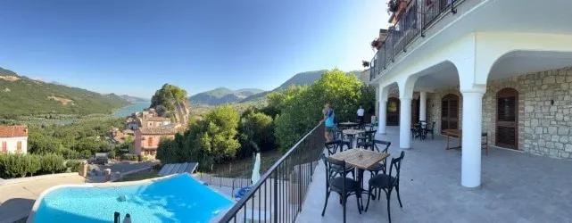BBB pool terrace panorama with lake and village view